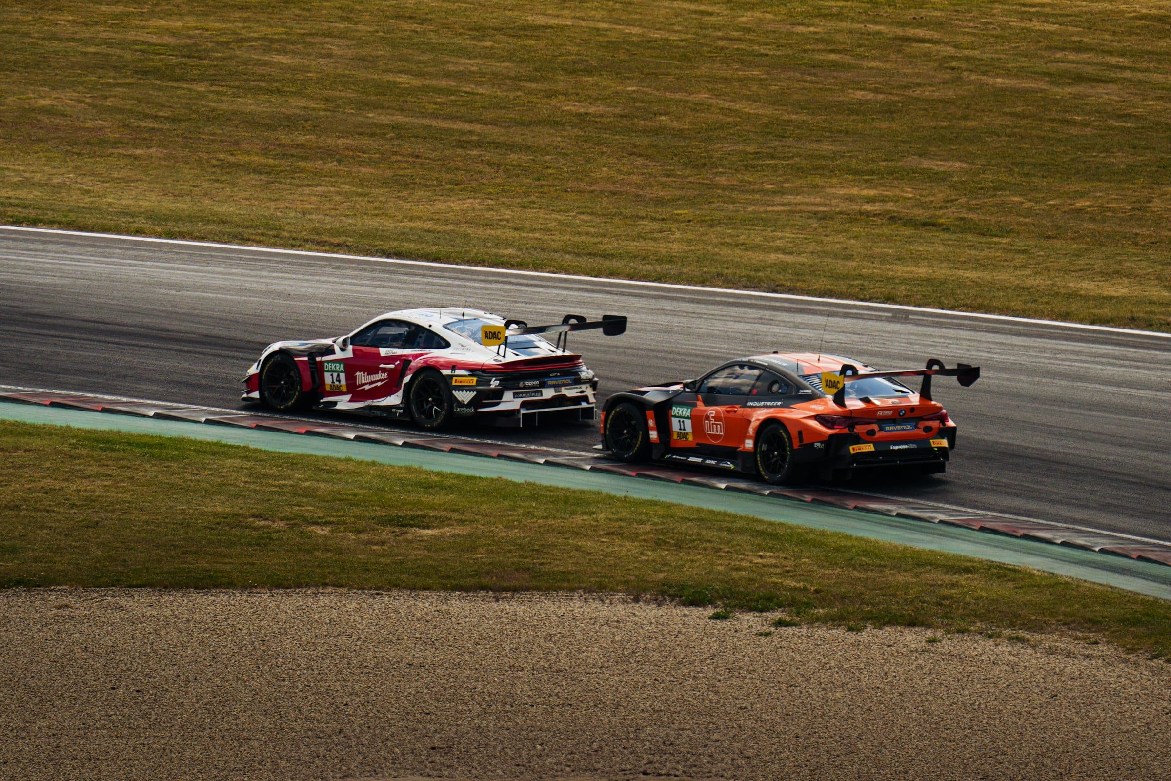 GT race cars competing on a circuit, reference photography